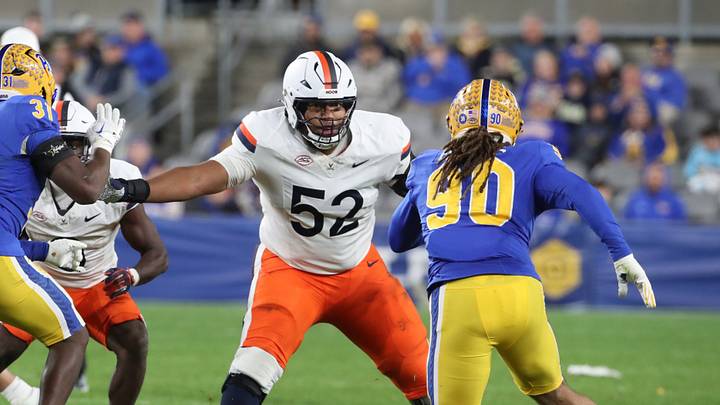 Nov 9, 2024; Pittsburgh, Pennsylvania, USA;  Virginia Cavaliers offensive lineman McKale Boley (52) blocks at the line of scrimmage against the Pittsburgh Panthers during the third quarter at Acrisure Stadium. Mandatory Credit: Charles LeClaire-Imagn Images