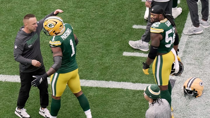 Green Bay Packers defensive coordinator Jeff Hafley hugs defensive end Micah Parsons (1) as defensive end Rashan Gary (52) looks on before their game against the Detroit Lions Sunday, September 7, 2025 at Lambeau Field in Green Bay, Wisconsin.