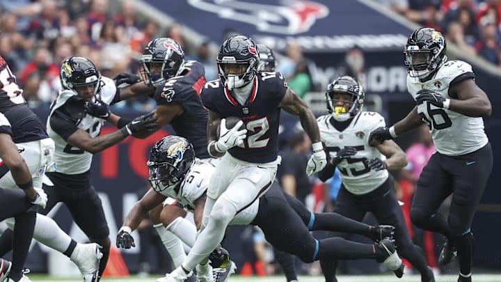 Sep 29, 2024; Houston, Texas, USA; Houston Texans wide receiver Nico Collins (12) runs with the ball during the second quarter against the Jacksonville Jaguars at NRG Stadium. Mandatory Credit: Troy Taormina-Imagn Images