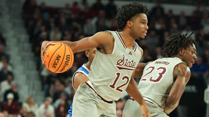 Jan 11, 2025; Starkville, Mississippi, USA; Mississippi State Bulldogs guard Josh Hubbard (12) handles the ball against the Kentucky Wildcats during the second half at Humphrey Coliseum. Mandatory Credit: Wesley Hale-Imagn Images