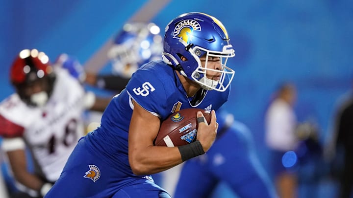 Oct 15, 2021; San Jose, California, USA; San Jose State Spartans quarterback Nick Nash (16) carries the ball during the fourth quarter against the San Diego State Aztecs at CEFCU Stadium. Mandatory Credit: Darren Yamashita-Imagn Images
