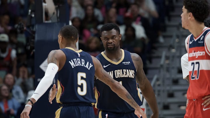 Mar 8, 2026; New Orleans, Louisiana, USA; New Orleans Pelicans forward Zion Williamson (1) reacts to a basket with guard Dejounte Murray (5) against the Washington Wizards during the first half at Smoothie King Center. Mandatory Credit: Matthew Hinton-Imagn Images