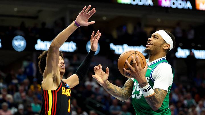 Mar 18, 2026; Dallas, Texas, USA; Dallas Mavericks forward P.J. Washington (25) shoots as Atlanta Hawks forward Jalen Johnson (1) defends during the first half at American Airlines Center. Mandatory Credit: Kevin Jairaj-Imagn Images Mar 18, 2026; Dallas, Texas, USA; Dallas Mavericks forward P.J. Washington (25) shoots as Atlanta Hawks forward Jalen Johnson (1) defends during the first half at American Airlines Center. Mandatory Credit: Kevin Jairaj-Imagn Images