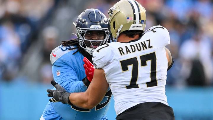 Dec 28, 2025; Nashville, Tennessee, USA; New Orleans Saints guard Dillon Radunz (77) blocks Tennessee Titans defensive tackle T'Vondre Sweat (93) during the second half at Nissan Stadium. Mandatory Credit: Steve Roberts-Imagn Images Dec 28, 2025; Nashville, Tennessee, USA; New Orleans Saints guard Dillon Radunz (77) blocks Tennessee Titans defensive tackle T'Vondre Sweat (93) during the second half at Nissan Stadium. Mandatory Credit: Steve Roberts-Imagn Images