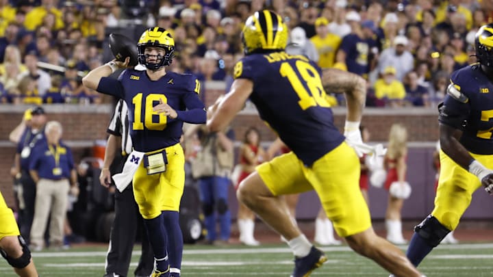 Aug 31, 2024; Ann Arbor, Michigan, USA;  Michigan Wolverines quarterback Davis Warren (16) throws the ball against the Fresno State Bulldogs in the first half at Michigan Stadium. Mandatory Credit: Rick Osentoski-USA TODAY Sports