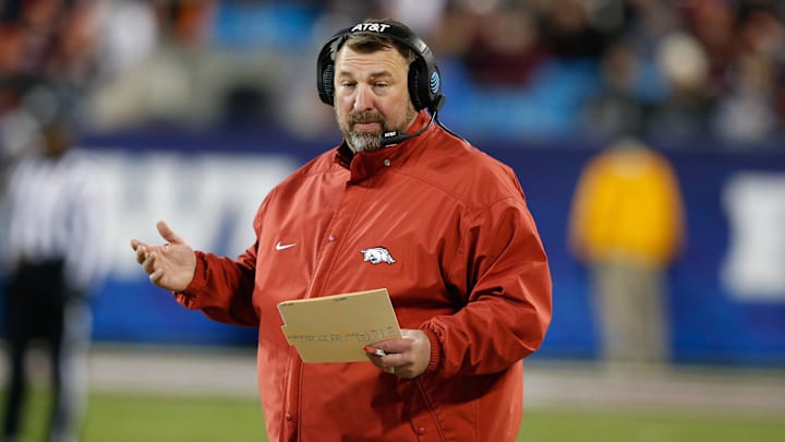 Dec 29, 2016; Charlotte, NC, USA; Arkansas Razorbacks head coach Brett Bielema stands on the sidelines during the first quarter against the Virginia Tech Hokies during the Belk Bowl at Bank of America Stadium. Mandatory Credit: Jeremy Brevard-Imagn Images