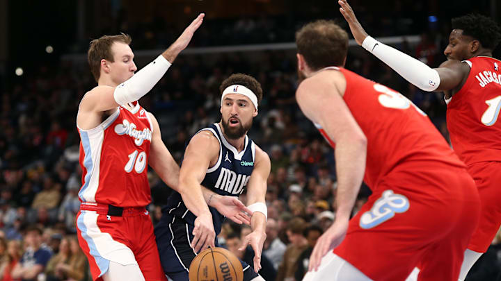 Jan 6, 2025; Memphis, Tennessee, USA; Dallas Mavericks guard Klay Thompson (31) passes the ball as Memphis Grizzlies guard Luke Kennard (10) defends during the second quarter at FedExForum. Mandatory Credit: Petre Thomas-Imagn Images