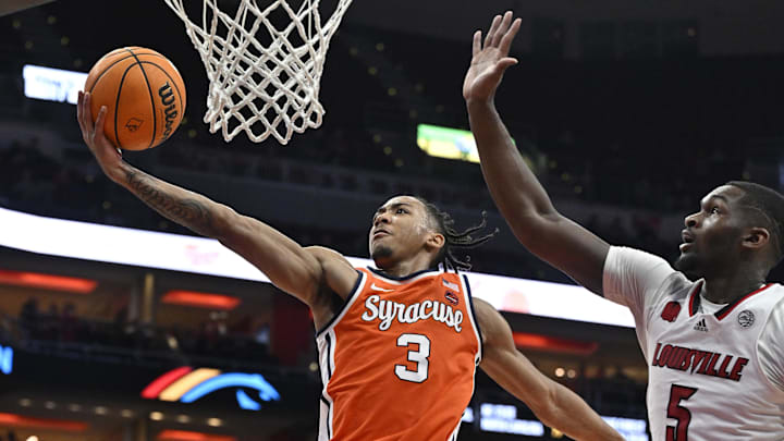 Mar 2, 2024; Louisville, Kentucky, USA; Syracuse Orange guard Judah Mintz (3) shoots against Louisville Cardinals forward Brandon Huntley-Hatfield (5) during the first half at KFC Yum! Center. Mandatory Credit: Jamie Rhodes-Imagn Images