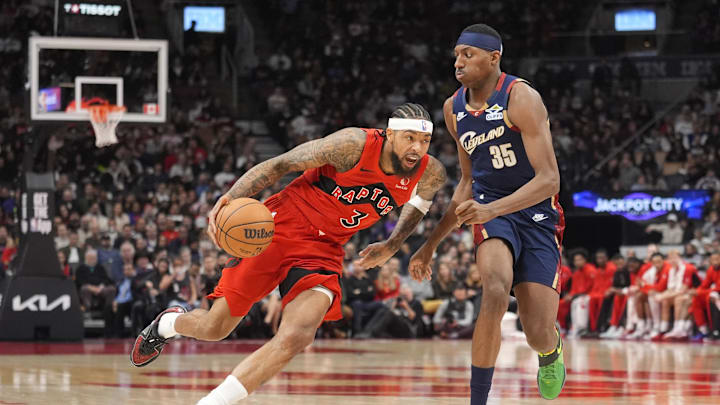 Nov 24, 2025; Toronto, Ontario, CAN; Toronto Raptors forward Brandon Ingram (3) drives to the net against Cleveland Cavaliers forwqrd Nae Qwan Tomlin (35) during the first half at Scotiabank Arena. Mandatory Credit: John E. Sokolowski-Imagn Images