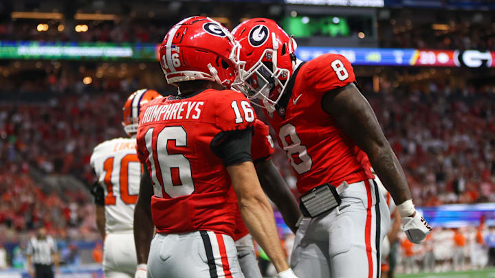 Aug 31, 2024; Atlanta, Georgia, USA; Georgia Bulldogs wide receiver London Humphreys (16) celebrates after a touchdown with wide receiver Colbie Young (8) against the Clemson Tigers in the third quarter at Mercedes-Benz Stadium. Mandatory Credit: Brett Davis-Imagn Images Aug 31, 2024; Atlanta, Georgia, USA; Georgia Bulldogs wide receiver London Humphreys (16) celebrates after a touchdown with wide receiver Colbie Young (8) against the Clemson Tigers in the third quarter at Mercedes-Benz Stadium. Mandatory Credit: Brett Davis-Imagn Images