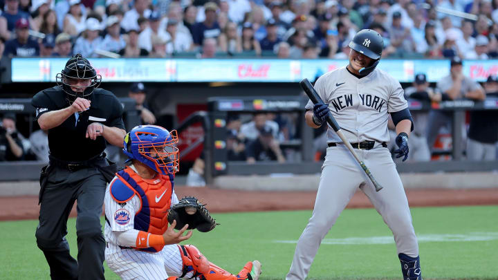 Jun 25, 2024; New York City, New York, USA; New York Yankees first baseman J.D. Davis (38) reacts after striking out to end the top of the first inning against the New York Mets at Citi Field.