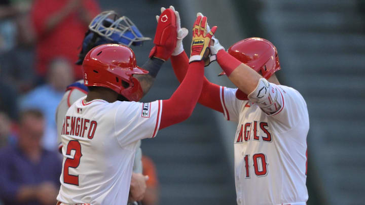 Jul 28, 2025; Anaheim, California, USA; Los Angeles Angels third baseman Kevin Newman (10) crosses the plate after hitting a two-run home run scoring third baseman Luis Rengifo (2) during the third inning against the Texas Rangers at Angel Stadium. Mandatory Credit: Jayne Kamin-Oncea-Imagn Images Jul 28, 2025; Anaheim, California, USA; Los Angeles Angels third baseman Kevin Newman (10) crosses the plate after hitting a two-run home run scoring third baseman Luis Rengifo (2) during the third inning against the Texas Rangers at Angel Stadium. Mandatory Credit: Jayne Kamin-Oncea-Imagn Images