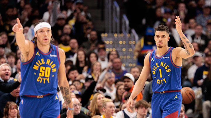 Apr 20, 2024; Denver, Colorado, USA; Denver Nuggets forward Aaron Gordon (50) and forward Michael Porter Jr. (1) react during the first quarter against the Los Angeles Lakers in game one of the first round for the 2024 NBA playoffs at Ball Arena. Mandatory Credit: Andrew Wevers-Imagn Images