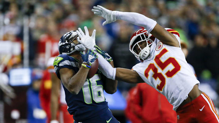 Dec 23, 2018; Seattle, WA, USA; Seattle Seahawks wide receiver Tyler Lockett (16) catches a 45-yard pass against Kansas City Chiefs cornerback Charvarius Ward (35) during the fourth quarter at CenturyLink Field. Mandatory Credit: Joe Nicholson-Imagn Images