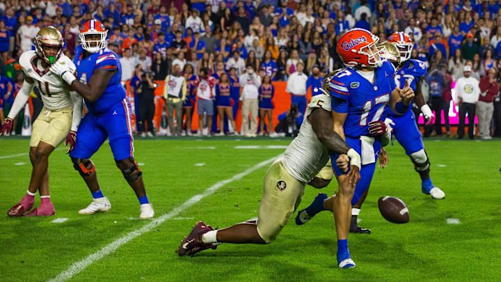 Florida State Seminoles defensive lineman Jared Verse (5) sacks Florida Gators quarterback Max Brown (17) at Steve Spurrier Field at Ben Hill Griffin Stadium in Gainesville, FL on Saturday, November 25, 2023 during the second half. Florida State won 24-15. [Doug Engle/Gainesville Sun]
