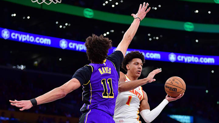 Jan 3, 2025; Los Angeles, California, USA; Atlanta Hawks forward Jalen Johnson (1) moves the ball against Los Angeles Lakers center Jaxson Hayes (11) during the first half at Crypto.com Arena. Mandatory Credit: Gary A. Vasquez-Imagn Images