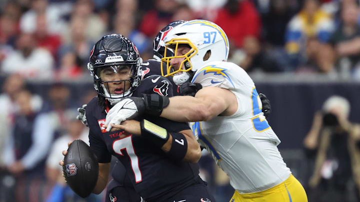 Jan 11, 2025; Houston, Texas, USA; Los Angeles Chargers outside linebacker Joey Bosa (97) sacks Houston Texans quarterback C.J. Stroud (7) during the first quarter in an AFC wild card game at NRG Stadium. Mandatory Credit: Troy Taormina-Imagn Images Jan 11, 2025; Houston, Texas, USA; Los Angeles Chargers outside linebacker Joey Bosa (97) sacks Houston Texans quarterback C.J. Stroud (7) during the first quarter in an AFC wild card game at NRG Stadium. Mandatory Credit: Troy Taormina-Imagn Images