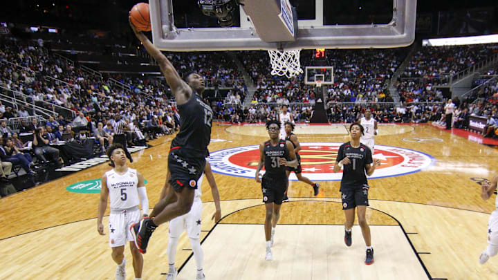 Mar 28, 2018; Atlanta, GA, USA; McDonalds All-American East forward Zion Williamson (12) dunks against the West in the second half of the McDonalds High School All American Game  at Philips Arena. Mandatory Credit: Brett Davis-Imagn Images