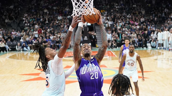 Nov 21, 2024; San Antonio, Texas, USA; Utah Jazz forward John Collins (20) drives to the basket against San Antonio Spurs guard Stephon Castle (5) during the second half Bank Center. Mandatory Credit: Scott Wachter-Imagn Images