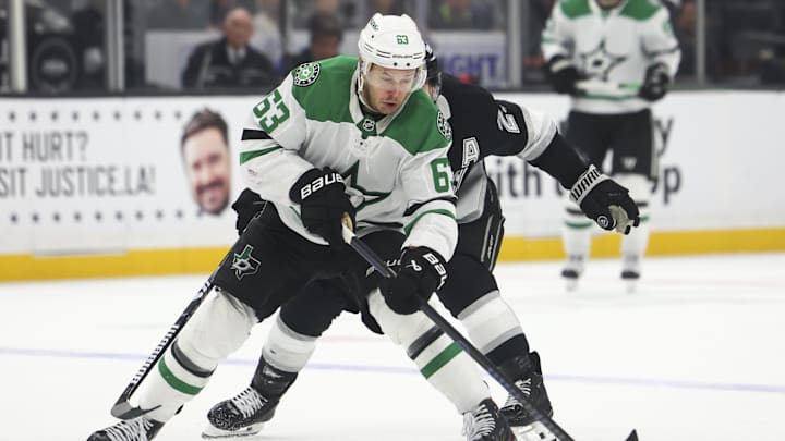 Dec 4, 2024; Los Angeles, California, USA; Dallas Stars right wing Evgenii Dadonov (63) skates with the puck against the Los Angeles Kings during the third period of a hockey game at Crypto.com Arena. Mandatory Credit: Jessica Alcheh-Imagn Images