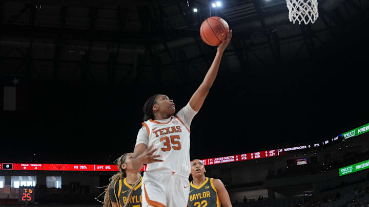 Dec 14, 2025; Fort Worth, Texas, USA; Texas Longhorns forward Madison Booker (35) scores a layup ahead of Baylor Bears forward Darianna Littlepage-Buggs (5) during the first half at Dickies Arena. Mandatory Credit: Chris Jones-Imagn Images Dec 14, 2025; Fort Worth, Texas, USA; Texas Longhorns forward Madison Booker (35) scores a layup ahead of Baylor Bears forward Darianna Littlepage-Buggs (5) during the first half at Dickies Arena. Mandatory Credit: Chris Jones-Imagn Images
