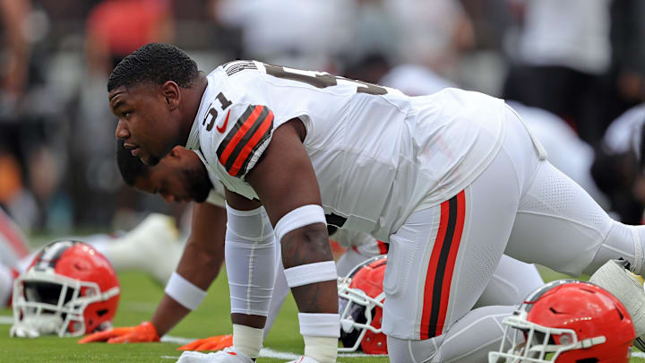 Browns defensive tackle Mike Hall Jr. stretches before a preseason game at Cleveland Browns Stadium, Saturday, Aug. 10, 2024.