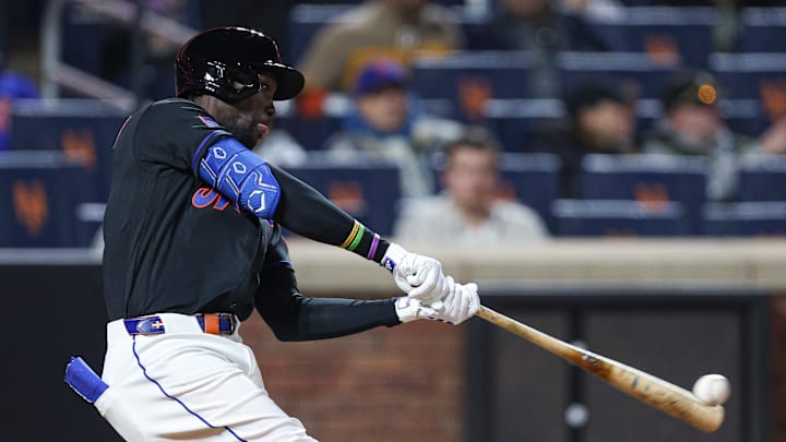 Apr 24, 2026; New York City, New York, USA;  New York Mets third baseman Ronny Mauricio (0) singles during the fifth inning against the Colorado Rockies at Citi Field. Mandatory Credit: Vincent Carchietta-Imagn Images