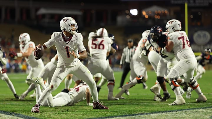 Nov 29, 2025; Charlottesville, Virginia, USA; Virginia Tech Hokies quarterback Kyron Drones (1) passes the ball from his own end zone against the Virginia Cavaliers in the third quarter at Scott Stadium. Mandatory Credit: Geoff Burke-Imagn Images