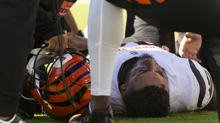 Oct 20, 2024; Cleveland, Ohio, USA; Cincinnati Bengals safety Geno Stone (22) lays on the ground with a leg injury during the fourth quarter against the Cleveland Browns at Huntington Bank Field. Mandatory Credit: Scott Galvin-Imagn Images