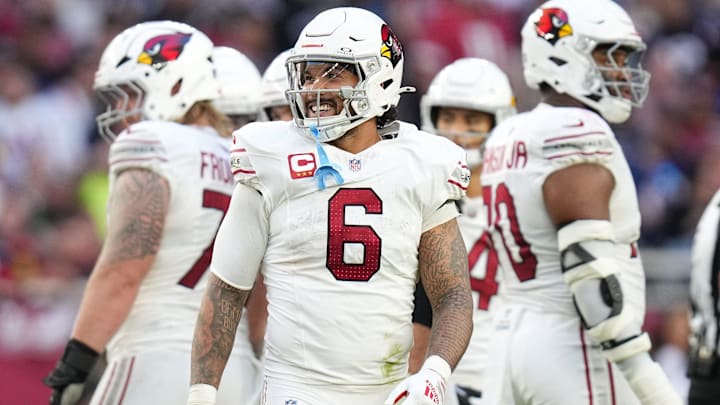 Arizona Cardinals running back James Conner (6) smiles as he comes out the huddle during their game against the New England Patriots at State Farm Stadium on Dec 15, 2024.