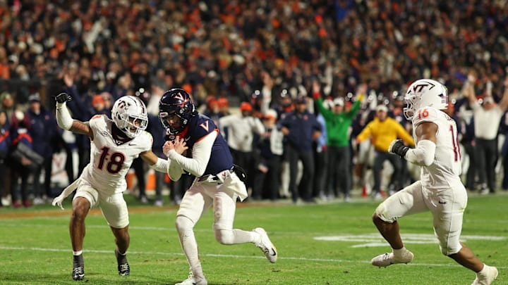 Nov 29, 2025; Charlottesville, Va.; Virginia quarterback Chandler Morris (4) scores a touchdown on Virginia Tech. Nov 29, 2025; Charlottesville, Va.; Virginia quarterback Chandler Morris (4) scores a touchdown on Virginia Tech.