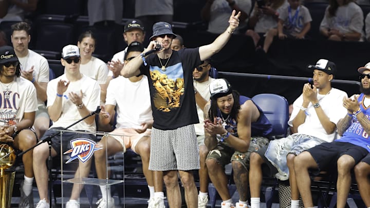Jun 24, 2025; Oklahoma City, OK, USA; Oklahoma City Thunder guard Alex Caruso (9) speaks to fans during the Champions Opening Ceremony for the parade inside the Paycom Center. Mandatory Credit: Alonzo Adams-Imagn Images Jun 24, 2025; Oklahoma City, OK, USA; Oklahoma City Thunder guard Alex Caruso (9) speaks to fans during the Champions Opening Ceremony for the parade inside the Paycom Center. Mandatory Credit: Alonzo Adams-Imagn Images