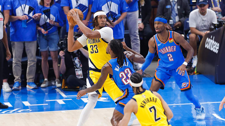 Jun 22, 2025; Oklahoma City, Oklahoma, USA; Indiana Pacers center Myles Turner (33) looks to pass while Oklahoma City Thunder guard Cason Wallace (22) defends during the first half of game seven of the 2025 NBA Finals at Paycom Center. Mandatory Credit: Alonzo Adams-Imagn Images