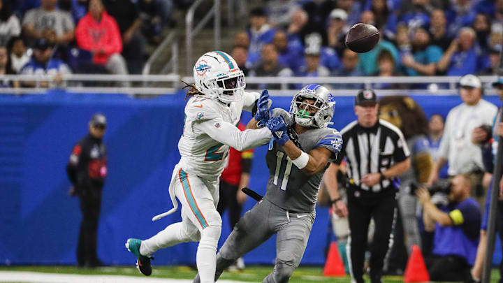 Oct 30, 2022; Detroit, Michigan, USA; Miami Dolphins cornerback Keion Crossen (27) tackles as Detroit Lions wide receiver Josh Reynolds (8) tries to make a catch during the second half at Ford Field. Mandatory Credit: Junfu Han-Imagn Images Oct 30, 2022; Detroit, Michigan, USA; Miami Dolphins cornerback Keion Crossen (27) tackles as Detroit Lions wide receiver Josh Reynolds (8) tries to make a catch during the second half at Ford Field. Mandatory Credit: Junfu Han-Imagn Images