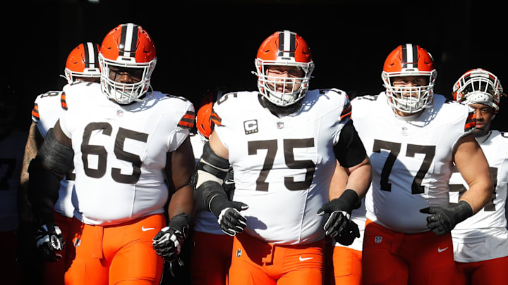 Dec 8, 2024; Pittsburgh, Pennsylvania, USA;  Cleveland Browns guards Germain Ifedi (65) and Joel Bitonio (75) and Wyatt Teller (77) take the field to play the Pittsburgh Steelers at Acrisure Stadium. Mandatory Credit: Charles LeClaire-Imagn Images