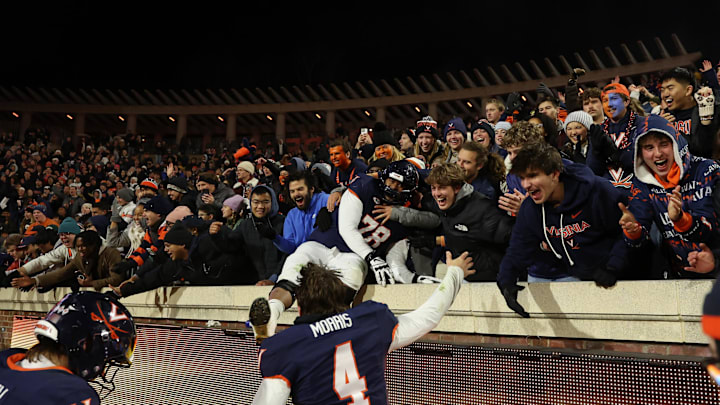 Nov 29, 2025; Charlottesville, Virginia, USA; Virginia Cavaliers quarterback Chandler Morris (4) celebrates with fans after the Cava;liers' game against the Virginia Tech Hokies at Scott Stadium. Mandatory Credit: Geoff Burke-Imagn Images
