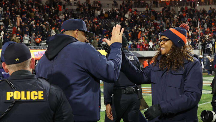 Nov 29, 2025; Charlottesville, Virginia, USA; Virginia Cavaliers head coach Tony Elliott (L) celebrates with Virginia director of athletics Carla Williams (R) on the field after the Cavaliers' game against the Virginia Tech Hokies at Scott Stadium. Mandatory Credit: Geoff Burke-Imagn Images