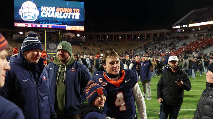 Nov 29, 2025; Charlottesville, Virginia, USA; Virginia Cavaliers quarterback Chandler Morris (4) poses for a picture with a young fan on the field after the Cavaliers' game against the Virginia Tech Hokies at Scott Stadium. Mandatory Credit: Geoff Burke-Imagn Images Nov 29, 2025; Charlottesville, Virginia, USA; Virginia Cavaliers quarterback Chandler Morris (4) poses for a picture with a young fan on the field after the Cavaliers' game against the Virginia Tech Hokies at Scott Stadium. Mandatory Credit: Geoff Burke-Imagn Images