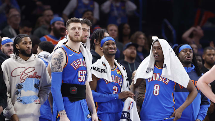 Feb 10, 2025; Oklahoma City, Oklahoma, USA; Oklahoma City Thunder guard Isaiah Joe (11), center Isaiah Hartenstein (55), forward Chet Holmgren (7), guard Shai Gilgeous-Alexander (2), forward Jalen Williams (8) and guard Luguentz Dort (5) watch the end of a game against the New Orleans Pelicans at Paycom Center. Mandatory Credit: Alonzo Adams-Imagn Images Feb 10, 2025; Oklahoma City, Oklahoma, USA; Oklahoma City Thunder guard Isaiah Joe (11), center Isaiah Hartenstein (55), forward Chet Holmgren (7), guard Shai Gilgeous-Alexander (2), forward Jalen Williams (8) and guard Luguentz Dort (5) watch the end of a game against the New Orleans Pelicans at Paycom Center. Mandatory Credit: Alonzo Adams-Imagn Images