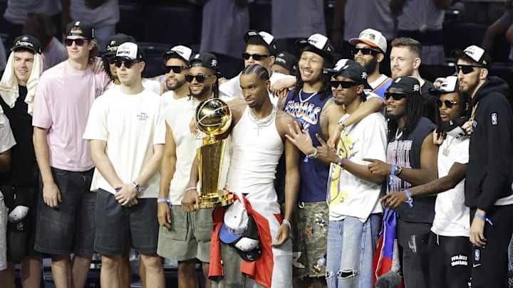 Jun 24, 2025; Oklahoma City, OK, USA; Oklahoma City Thunder guard Shai Gilgeous-Alexander (2) holds the Larry OíBrien Championship Trophy with the team behind him during the Champions Opening Ceremony for the parade inside the Paycom Center. Mandatory Credit: Alonzo Adams-Imagn Images