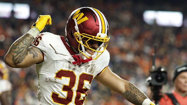 Nov 30, 2025; Landover, Maryland, USA; Washington Commanders running back Chris Rodriguez Jr. (36) celebrates after scoring a touchdown against the Denver Broncos in the second quarter at Northwest Stadium. Mandatory Credit: Geoff Burke-Imagn Images