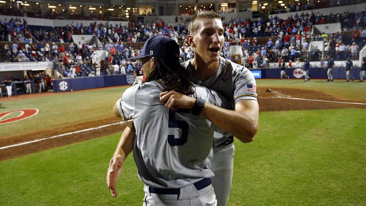 Jun 2, 2025; Oxford, MS, USA; Murray State Racers relief pitcher Graham Kelham (41) reacts with pitcher Harper McLendon (5) after defeating the Mississippi Rebels in the Oxford Regional. Mandatory Credit: Petre Thomas-Imagn Images Jun 2, 2025; Oxford, MS, USA; Murray State Racers relief pitcher Graham Kelham (41) reacts with pitcher Harper McLendon (5) after defeating the Mississippi Rebels in the Oxford Regional. Mandatory Credit: Petre Thomas-Imagn Images