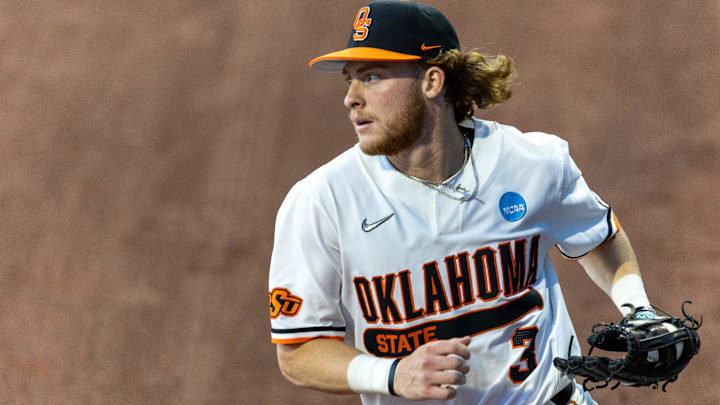 Oklahoma State utility Carson Benge (3) catches the ball in the outfield during a regional NCAA Baseball game against Niagara at O'Brate Stadium in 2024.