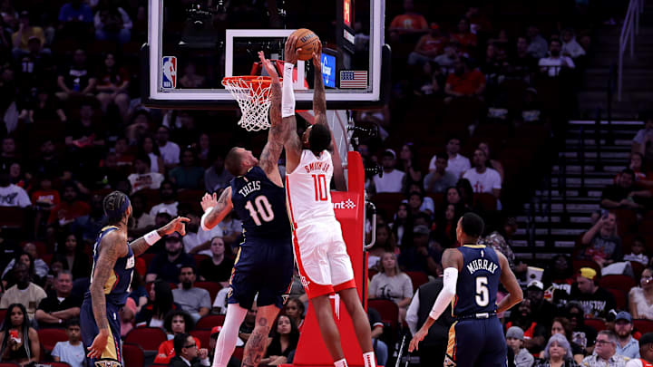 Oct 15, 2024; Houston, Texas, USA; Houston Rockets forward Jabari Smith Jr (10) looks to dunk against New Orleans Pelicans center Daniel Theis (10) during the first quarter at Toyota Center. 