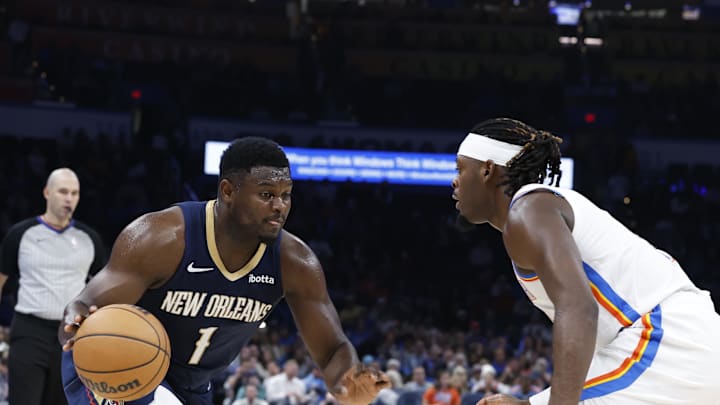 Nov 1, 2023; Oklahoma City, Oklahoma, USA; New Orleans Pelicans forward Zion Williamson (1) drives against Oklahoma City Thunder guard Luguentz Dort (5) during the second half at Paycom Center. New Orleans won 110-106. Mandatory Credit: Alonzo Adams-Imagn Images