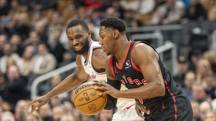 Feb 21, 2025; Toronto, Ontario, CAN; Toronto Raptors guard RJ Barrett (9) dribbles the ball against Miami Heat forward Andrew Wiggins (22) during first half at Scotiabank Arena. Mandatory Credit: Kevin Sousa-Imagn Images