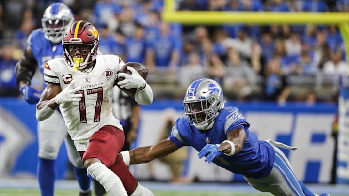 Sep 18, 2022; Detroit, Michigan, USA;  Washington Commanders wide receiver Terry McLaurin (17) runs against Detroit Lions cornerback Jeff Okudah (1) during the second half at Ford Field. Mandatory Credit: Junfu Han-Imagn Images