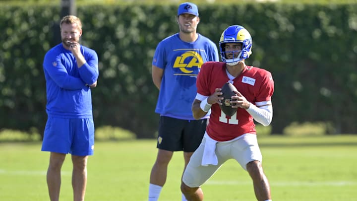 Los Angeles Rams quarterback Matthew Stafford (9) and head coach Sean McVay look on as quarterback Jimmy Garoppolo (11) participates in drills during training camp at Loyola Marymount University.