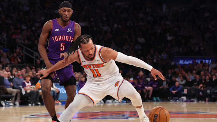 New York Knicks guard Jalen Brunson loses the ball against Toronto Raptors guard Immanuel Quickley.