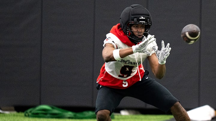 Cincinnati Bearcats wide receiver Jeff Caldwell (9) catches a pass during football practice at Sheakley Athletic Performance Center in Cincinnati on Dec. 18, 2025.
